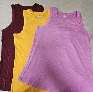 3 never worn Muscle tees size M